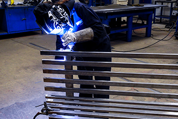 WEC group Apprentices welding steel bench