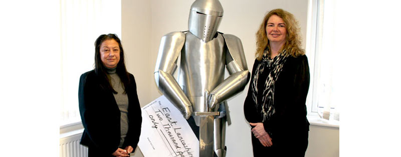 Marlene donating money to East Lancashire Hospice